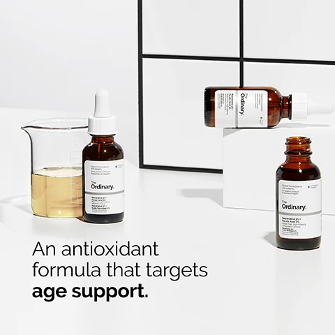 Image 1 - Image shows two brown glass bottles of The Ordinary skincare products next to a clear laboratory beaker containing a yellow liquid, with a white background and black geometric lines, and the text reads An antioxidant formula that targets age support.
Image 2 - A drop of light-colored serum is suspended from a clear pipette with text on the left stating offers daily skin protection from the impact of oxidative stress and 3% resveratrol 3% ferulic acid.
Image 3 - A woman with medium skin tone is smiling and gently touching her cheek while applying a skincare product, with the text Apply a few drops to the face in the morning and evening displayed next to her.
Image 4 - A close-up view of two droplets of a yellow anhydrous serum on a white background, with the text Anhydrous serum texture positioned beside them.
Image 5 - An image displaying three rows of skincare products: the top row labeled PREP includes cleansers and toners; the middle row labeled TREAT features water-based serums, eye serums, anhydrous solutions highlighted in dark, and oils; the bottom row labeled SEAL shows suspensions, moisturizers, and SPF products.