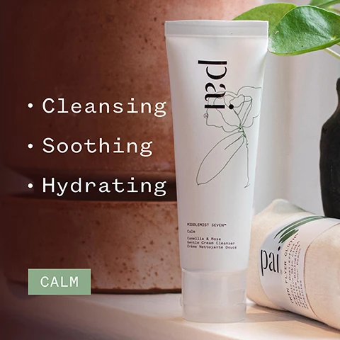Image 1 - A tube of cleansing cream labeled MIDDLEMIST SEVEN with descriptions of Cleansing, Soothing, and Hydrating, beside a partially visible package of another product, and a green CALM banner in the corner.
Image 2 - A close-up of a persons face with a white cream applied to their cheek, showcasing a smooth complexion and a slight smile, accompanied by five stars above a testimonial stating beautifully soothing cleanser - leaves my skin feeling clean and comfortable, followed by the name DEBBIE C and icons for organic and vegan certification.