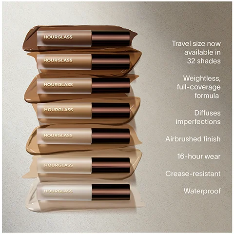 Image 1 - A stack of six Hourglass cosmetic tubes in various shades is placed against a neutral background, with accompanying text on the right highlighting features such as travel size, weightless full-coverage formula, diffuses imperfections, airbrushed finish, 16-hour wear, crease-resistant, and waterproof.