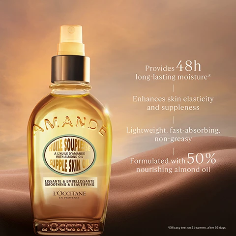 Image 1 - A bottle of LOccitane almond skin oil sits against a warm, sandy background, with text highlighting its features: Provides 48h long-lasting moisture, enhances skin elasticity and suppleness, lightweight, fast-absorbing, non-greasy, and formulated with 50% nourishing almond oil.
Image 2 - A hand is holding a spray bottle while another hand is positioned underneath to catch the mist, with the text Vegan prominently above and 97% natural-origin ingredients at the bottom.
Image 3 - A bottle of LOccitane Amande Supple Skin Oil is displayed against a soft, blurred background with the text MAKE TIME FOR BODY BLISS above it.
Image 4 - An image of a womans leg and foot against a neutral background, with visible text stating 100% said the product improves skin elasticity and provides 48h long-lasting hydration.
Image 5 - A close-up of a womans shoulder and arm with glowing skin, accompanied by text that reads Visibly Smoother, Firmer-Looking Skin.