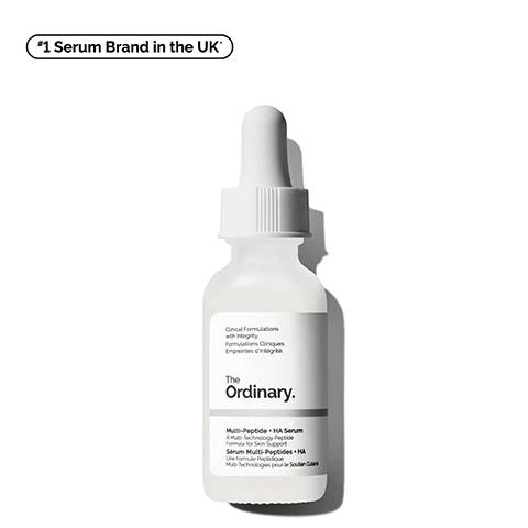 Image 1 - A clear dropper bottle of The Ordinary Multi-Peptide + HA Serum with a white label that includes the text Clinical Formulations with Integrity, Multi-Peptide + HA Serum, and *1 Serum Brand in the UK*.
Image 2 - A clear dropper filled with a liquid is shown alongside three icons and text that states targets the look of wrinkles and firmness, supports skins elasticity, and improves the look of skin smoothness.
Image 3 - A close-up of a smiling woman touching her cheek, with visible text labels that read Targets Wrinkles, Firming, and Improves Elasticity.
Image 4 - Image showing a close-up of a clear serum with bubbles, labeled with key ingredients, including ARGIRELOX™ & SYN™-AKE, Matrixyl™ 3000 & Matrixyl™ synthe6™, and Hyaluronic Acid, along with descriptions of their benefits for skin care.
Image 5 - A bottle of The Ordinary Multi-Peptide + HA Serum is positioned against a white textured background, with text that reads significantly reduce the appearance of crows feet with the power of peptides.
Image 6 - An infographic titled Pick Your Peptide Serum displays four different serum options with labels including Matrixyl 10% + HA, Argireline Solution 10%, Multi-Peptide + HA Serum, and Multi-Peptide + Copper Peptides 1% Serum, alongside descriptions of their benefits regarding fine lines, dynamic lines, skin elasticity, and aging.