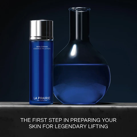 Image 1 - A blue bottle labeled Skin Caviar Essence-in-Lotion by La Prairie sits next to a glass container filled with blue liquid, with the text The first step in preparing your skin for legendary lifting below.
Image 2 - Three circular containers showcase skincare ingredients: the top one contains a bubbly golden liquid labeled Exclusive Cellular Complex™ with the description energizes and boosts skins natural repair process; the middle one has small yellow caviar-like beads labeled Caviar Extract with the description helps to nourish the skin and provides anti-aging powers; the bottom one shows a pale gray liquid labeled Caviar Water with the description composed of the most delicate elements of caviar.
Image 3 - A blue bottle of skincare product with a metallic cap, labeled SKIN CAVIAR ESSENCE-IN-LOTION and LA PRAIRIE SWITZERLAND, accompanied by water droplets, with text reading RICH AND SILKY PRE-SERUM TREATMENT FOR ELASTICITY OVER TIME.
Image 4 - Image shows two steps for applying a skincare product, with the first image displaying a hand pouring a small amount of liquid from a blue bottle into the palm, and the second image showing a woman smoothing the product over her face and neck; visible text reads POUR A SMALL AMOUNT INTO THE PALM OF YOUR HAND and SMOOTH OVER FACE AND NECK, AVOIDING THE EYE AREA.