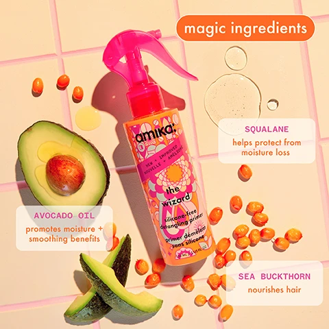 Image 1 - A bottle of amika hair product titled the wizard is shown on a light pink tiled background, alongside an avocado cut in half and scattered orange sea buckthorn berries; visible text highlights magic ingredients, squalane helps protect from moisture loss, avocado oil promotes moisture + smoothing benefits, and sea buckthorn nourishes hair.
Image 2 - A hand holding a pink spray bottle labeled amika! the wizard silicone-free detangling primer with features listed as infused with squalane, protects against 450°F heat, reduces frizz, and detangles all hair types.
Image 3 - Three-step hair care guide featuring three women: first, a woman in an orange top misting product onto damp hair; second, the same woman combing through her hair with an orange comb; third, the same woman smiling while holding the product with styled hair. Visible text reads hair magic in 3 steps, evenly mist through damp hair, comb through to detangle, blow dry or style as usual.
Image 4 - A person with curly hair winks while holding a bottle of Amika hair product against a pink background, with text above the image reading the magic of the wizard for all hair types.
Image 5 - A woman with long, wavy brown hair smiles while holding a pink spray bottle labeled Amika, set against a bright pink background.
Image 6 - An infographic displaying a list of product features including silicone-free, vegan, cruelty-free, paraben-free, color-safe, SLS and SLES free, phthalate-free, suitable for chemically treated hair, and no mineral oil, with corresponding icons for each feature.