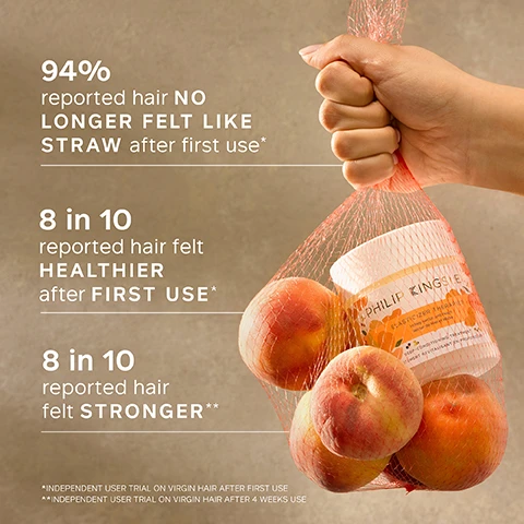 Image 1 - A hand holding a mesh bag filled with apples and a jar of Philip Kingsley Elasticizer Therapy, with text stating 94% reported hair no longer felt like straw after first use, 8 in 10 reported hair felt healthier after first use, and 8 in 10 reported hair felt stronger.
Image 2 - A blurred cup is shown in the foreground with a customer review about a hair mask printed on a pastel background, stating the positive effects of using the product, followed by the words CUSTOMER REVIEW.
Image 3 - A bowl of fresh peaches with honey drizzled over them, set against a soft pink background, accompanied by text indicating fragrance notes: HEAD Sweet peach, honey, almond; HEART Rose geranium, tuberose, jasmine; BASE Comforting musk, amber.
Image 4 - A jar of Philip Kingsley Elasticizer Therapies with a floral design on the front rests on a textured beige surface, accompanied by a list of key ingredients including Hydrolyzed Elastin, Castor Oil, Olive Oil, and Glycerin, each with a brief description of its benefits.
Image 5 - A hand holds a container of Philip Kingsley Elasticizer Therapies, with the product name and description visible, beside a text box that gives a trichologist tip about wrapping hair in a warm towel after applying the treatment.
Image 6 - Image shows a textured peach-colored background with white text listing key benefits of a hair product, including clinically proven to reduce breakage after just one use, restores elasticity and bounce, leaves hair strong and shiny, and banishes tangles and frizz, with a footnote about reduction in breakage after one use.