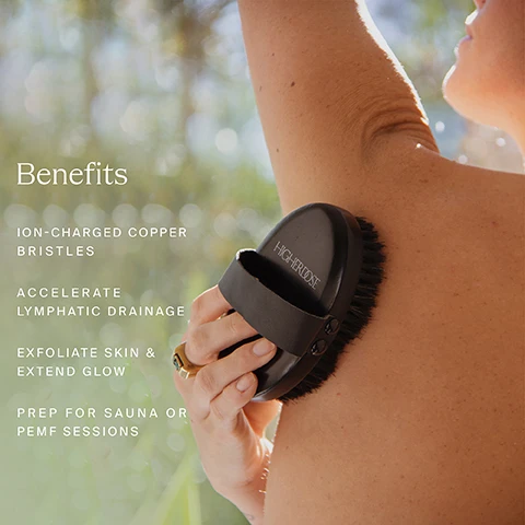Image 1 - A close-up image of a person using a black body brush with copper bristles on their arm, accompanied by text that lists benefits: Benefits, Ion-charged copper bristles, Accelerate lymphatic drainage, Exfoliate skin & extend glow, Prep for sauna or PEMF sessions.
Image 2 - A woman in a white robe is using a dry brush on her leg while seated, with text on the side listing the benefits: Dry Brushing Benefits, Exfoliation, Boosts Energy, Ignites the Lymphatic System, Reveals Soft Skin.
Image 3 - A person with light skin is holding a black handheld device labeled HIGHDOSE against the arm of a person with darker skin, with text surrounding the image explaining the benefits of copper bristles: negative ions are natures natural charge, negative ions counterbalance the effects of positive ions released in modern, tech-filled lives, providing a sense of calm, antimicrobial and antiviral properties.