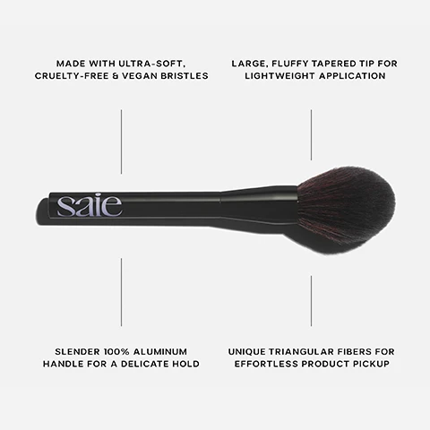 Image 1 - A black makeup brush with a fluffy tip is shown with text features including MADE WITH ULTRA-SOFT, CRUELTY-FREE & VEGAN BRISTLES, LARGE, FLUFFY TAPERED TIP FOR LIGHTWEIGHT APPLICATION, SLENDER 100% ALUMINUM HANDLE FOR A DELICATE HOLD, UNIQUE TRIANGULAR FIBERS FOR EFFORTLESS PRODUCT PICKUP, and the logo saie. Image 2 - A black makeup brush is shown next to a compact powder with the Saie logo and text that says BEST FOR Powder formulas Large areas USE WITH SLIP TINT™ BAKED SETTING POWDER.