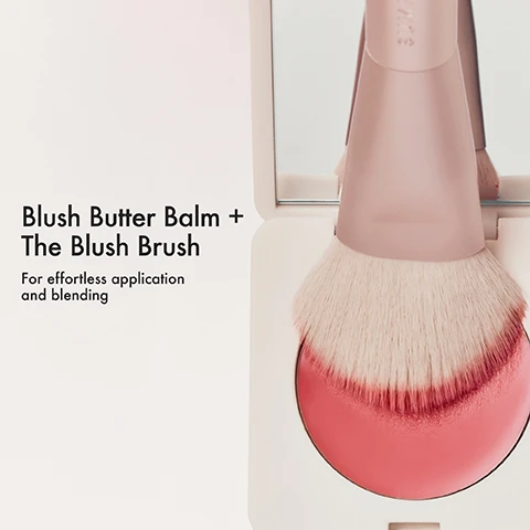 Image 2 - A blush brush is dipping into a pink blush compact Blush Butter Balm + The Blush Brush For effortless application and blending. Image 3 - A hand holds a pink blush compact and a silver dual-ended makeup brush with the text SUMMER FRIDAYS, alongside descriptions reading Ergonomic handle and dual-ended bristles, Ultra-soft yet firm—for smooth, even coverage, and Blends like a dream. Image 4 - A hand holds a double-ended makeup brush with text instructions How To Use THE BLUSH BRUSH Using the ultra-plush end, blend into cheeks for an effortless finish. Using the smaller angled end, lightly tap the brush into your favorite cream blush and apply to the high points of the cheeks. SUMMER FRIDAYS is on the handle. Image 6 - A close-up of a makeup brush with light pink bristles and text that reads PRO TIP: use the ultra plush end to apply and blend Sheer Skin Tint.