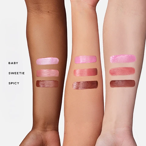 Image 2 - Three forearms with varying skin tones display swatches of three lip gloss shades: light pink for Baby, rosy pink for Sweetie, and warm brown for Spicy. Image 3 - A grid image displays three blush shades, each shown on a color swatch and worn by three diverse models; the first row features a light pink swatch and models with Baby Cool Baby Pink blush, the second row shows a muted pink swatch and models with Sweetie Neutral Pink blush, and the third row presents a reddish-brown swatch and models with Spicy Warm Terracotta blush. Image 4 - A smiling Black woman with curly hair has three dots of pink blush on her left cheek, with a makeup brush held near her right cheek, alongside text that reads SAIEGLOW™ STACK TIPS: Buff out with The Double Brush (sold separately) Mix with Glowy Super Gel™ (sold separately) Stack two shades of Dew Blush™ together 1 APPLY 2-3 DOTS ON CHEEKS 2 BLEND UPWARDS 3 REPEAT TO BUILD. Image 5 - The image displays swatches of Dew Blush in various shades like pink, peach, coral, and brown, with accompanying text: Dew Blush, Buildable & blendable, Wash of color, Dewy-radiant finish, Targeted application, Vegan, Fragrance Free, Safe for Sensitive Skin, and Dermatologist Tested. Image 6 - A lip gloss applicator wand covered in shimmery, reddish-brown gloss rests on a swatch of the same product, next to text that reads: SUPERCHARGED INGREDIENTS POWERED BY SAIE SCIENCE™ HYDRATING Plant-Derived Glycerin FREE RADICAL PROTECTION Elderberry Fruit Extract BRIGHTENING Licorice Root Extract. Image 7 - The image shows a black dual-ended makeup brush with the Saie logo, an upright pale pink Saie Dew Blush bottle, and a coral Saie Dew Blush bottle lying on its side with its applicator extended, above the text DEW BLUSH™ + THE DOUBLE BRUSH = BFFS FOR A BLUSHED #SAIEGLOW™. Image 8 - The image shows a Saie Dew Blush product in a pink vial with the cap and applicator detached, illustrating a three-step recycling guide: HOW TO RECYCLE DEW BLUSH™ USE IT ALL UP AND THEN... Clean your empty dew blush vial. wipe down the cap and rod as well. Detach the doe-foot applicator and place in the trash. Recycle the clean vial, rod, and cap via Pact Collective*. *MAIL BACK OR DROP OFF AT A COLLECTION BIN IN PARTICIPATING SEPHORA STORES.