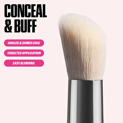 A close-up of a makeup brush with light-colored, angled bristles and a metallic silver ferrule against a light pink background, with text that reads Conceal & Buff, Angled & Domed Edge, Targeted Application, Easy Blending.