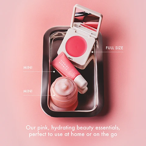 Image 2 - A silver tray on a pink background displays an open compact with bright pink blush and a mirror, labeled FULL SIZE, alongside a pink lip balm tube labeled MINI which says SUMMER FRIDAYS LIP BUTTER BALM BAUME À LÈVRES Pink Sugar Sucre Rose 7g | poids net wt 0.25 oz, and a pink jar of cream also labeled MINI, with additional text at the bottom of the image reading Our pink, hydrating beauty essentials, perfect to use at home or on the go. Image 3 - Close-up of a light pink gel cream moisturizer in a clear jar, topped with a soft peak of product, with the text MINI Cloud Dew Gel Cream Moisturizer Our lightweight gel cream moisturizer that delivers all-day hydration* *After 24 hours within an independent clinical study of 51 participants (ages 35–65) using Cloud Dew Gel Cream Moisturizer twice a day. Image 4 - Three close-up shots of two women with glowing skin wearing pink blush and glossy lips are displayed next to a textured swatch of pink product with the text Blush Butter Balm PINK SUNSET. Image 5 - An open white compact containing a circular pan of pink blush balm with a mirror in the lid rests on a dark pink balm, accompanied by text callouts: FULL SIZE Blush Butter Balm For a sheer flush of dewy color, MIRROR For on-the-go application, HYDRATING Infused with hydrating skincare ingredients, BLENDABLE Blends like butter, BUILDABLE Delivers long-lasting buildable color, *Benefits reflect results from an independent clinical study of 32 participants (ages 18-50); individual results may vary. Image 6 - Two pink lip butter balm containers with product oozing out are set against a pink background, with the text MINI Lip Butter Balm Pink Sugar Swipe on for sheer color, sweetness and immediate moisture* *Immediately after application within an independent clinical study with 39 participants (ages 20-55). Image 7 - The image displays a pink background with the text Lip Butter Balm Pink Sugar above four close-up photos of models wearing a glossy, pink-nude lip balm on different skin tones.