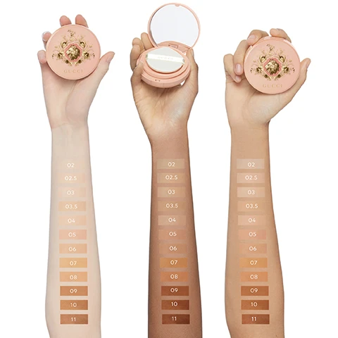 Image 1 - Three arms with different skin tones display 11 foundation swatches each, ranging from light to dark, labeled 02, 02.5, 03, 03.5, 04, 05, 06, 07, 08, 09, 10, and 11, with two hands holding closed light pink Gucci compacts and one hand holding an open light pink Gucci compact showing a mirror and puff, all featuring the text GUCCI. Image 2 - A womans face is split down the middle, showing her natural skin on the left and her skin with even-toned makeup on the right, with the text Before 04 After below. Image 3 - An open peachy-pink Gucci compact with an ornate lid and a puff featuring the text Gucci on its strap is shown next to a dark red rose and a clear liquid drop, with additional text Black Rose Oil Soothing and 24H Hydration Formula. Image 4 - A Gucci Beauty shade matching chart displays product images and lists corresponding shade numbers for different skin tone categories, with visible text including GUCCI beauty, MATCH YOUR IDEAL SHADE, GUCCI CUSHION DE BEAUTÉ, GUCCI CONCENTRÉ DE BEAUTÉ TO EVEN, TO BRIGHTEN, GUCCI MATTE POWDER, FAIR, FAIR MEDIUM, MEDIUM, and MEDIUM DEEP, with each category listing several shade numbers for each product. Image 5 - A three-step Gucci Beauty routine is displayed with a pink primer bottle, an open floral cushion compact with a puff, and a gold and pink pressed powder compact, alongside the text Gucci beauty Effortless Natural Face Routine 1 Prepare Primer Sérum de Beauté Fluide Soyeux 2 Care & Even Glow Cushion Cushion de Beauté 3 Set & Touch-Up Blurring & Mattifying Powder Gucci Matte Powder. Image 6 - A round, pale pink compact featuring a detailed gold lions head and floral design, with the name GUCCI, rests on a wavy beige background, accompanied by the text 90% SKICARE-BASED FORMULA*, 24H HYDRATION, and *SKINCARE BASE IS DEFINED AS THE FOUNDATION WITHOUT PIGMENTS. Image 7 - Three pink Gucci Cushion De Beauté compacts with a gold lion and floral design are displayed, one open revealing the foundation and a puff, alongside the text GUCCI, CUSHION DE BEAUTÉ, 24H HYDRATING LUMINOUS CUSHION FOUNDATION, and #GucciBeauty.